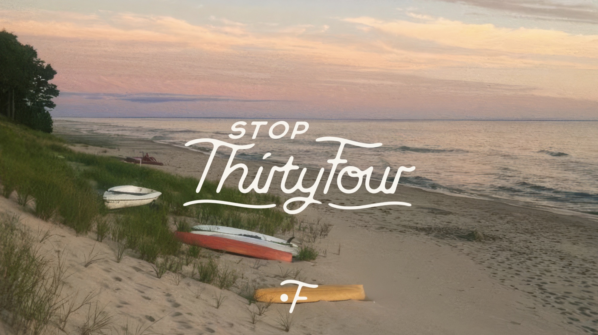 Stop ThirtyFour — a Great Lakes shoreline at dusk with overturned boats on the sand
